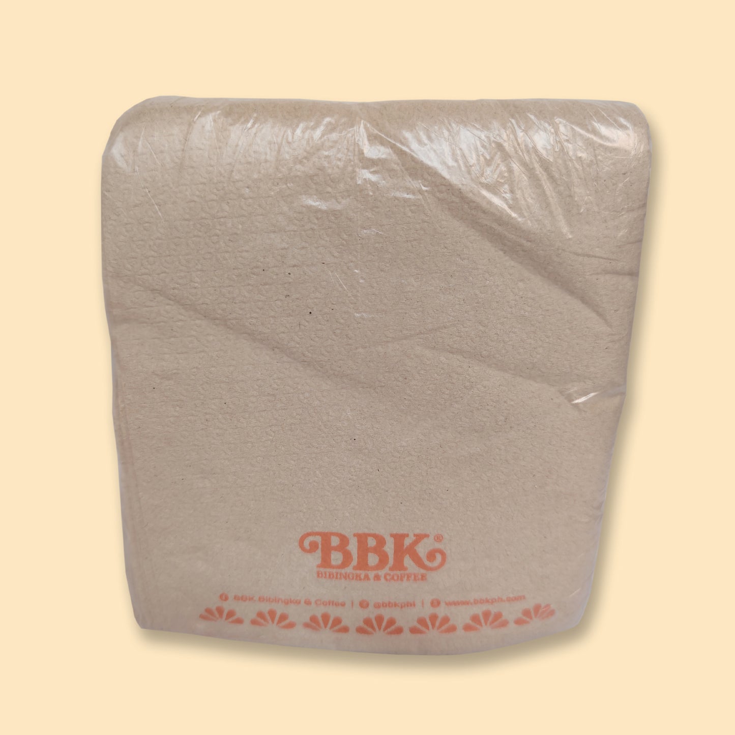 White paper tissue pack with BBK branding, wrapped in clear plastic on beige background