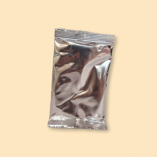 Hot chocolate powder 25g sachet in metallic silver packaging with sealed edges