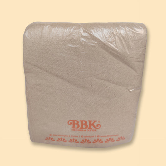 White paper tissue pack with BBK branding, wrapped in clear plastic on beige background